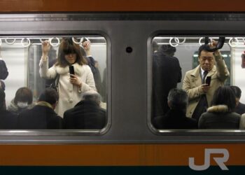 Man who stabbed at least 10 people on Tokyo train for 'looking happy' arrested