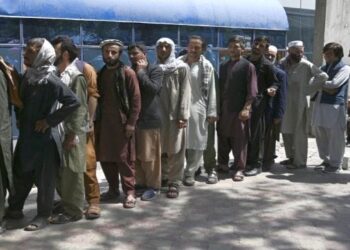 Cash-starved Afghans form long queues as bank operations resume