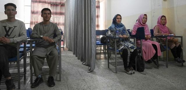 Curtains separate male and female students as Afghan universities reopen under Taliban rule
