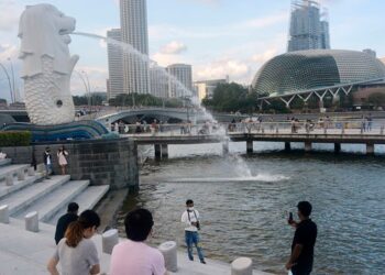 Living with COVID-19: Singapore's strategy raises hope and and concern among citizens as cases skyrocket