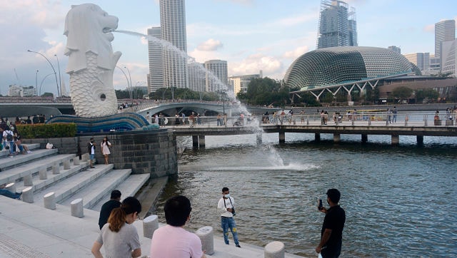 Living with COVID-19: Singapore's strategy raises hope and and concern among citizens as cases skyrocket